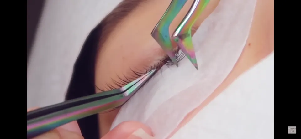 Specialist applying Japanese eyelash extensions to Namee Park. Toronto, Canada, 2019